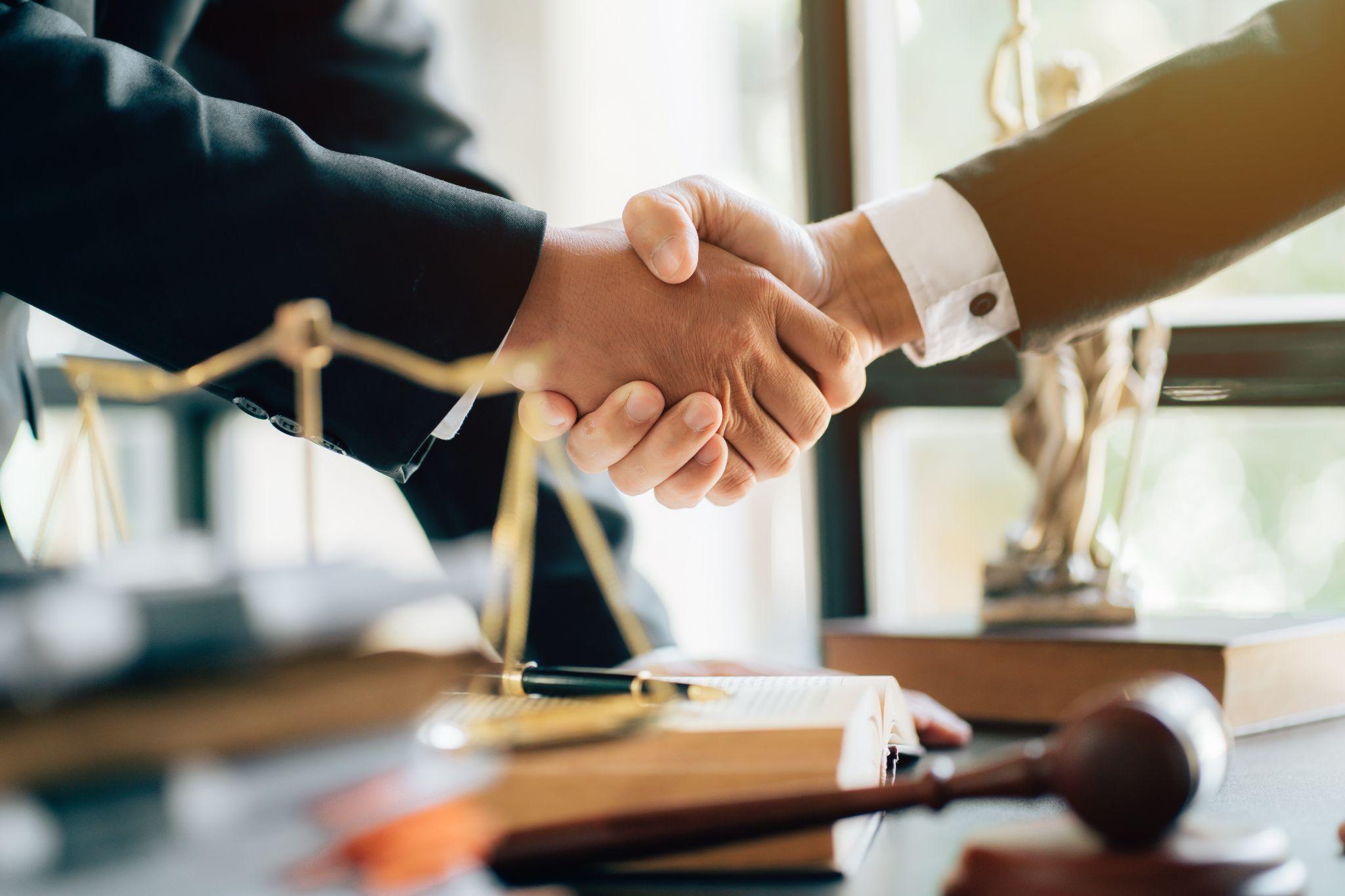 Lawyer shaking hands with a client