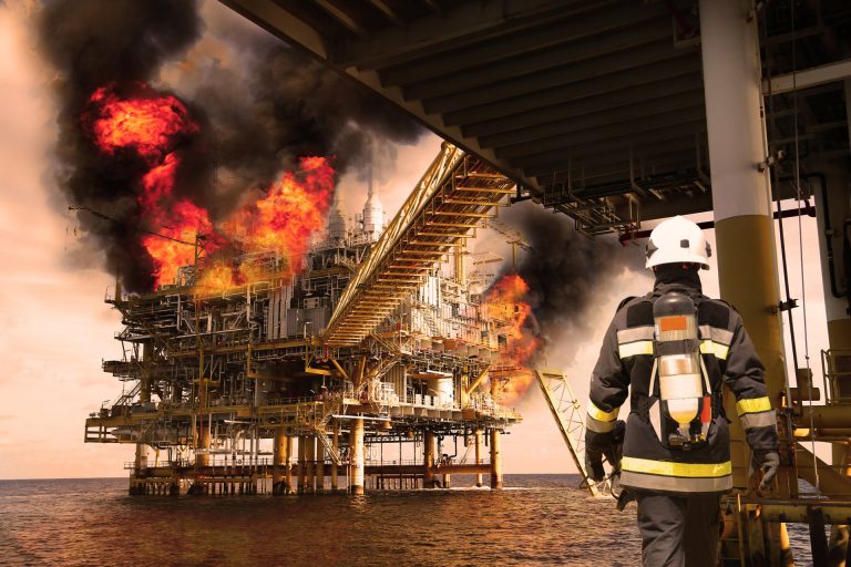 Fire fighter on oil and gas industry, successful firefighter at work , Fire suit for fighter with fire and suit for protect fire fighter, Security team when fire case and try to fight fire with team.