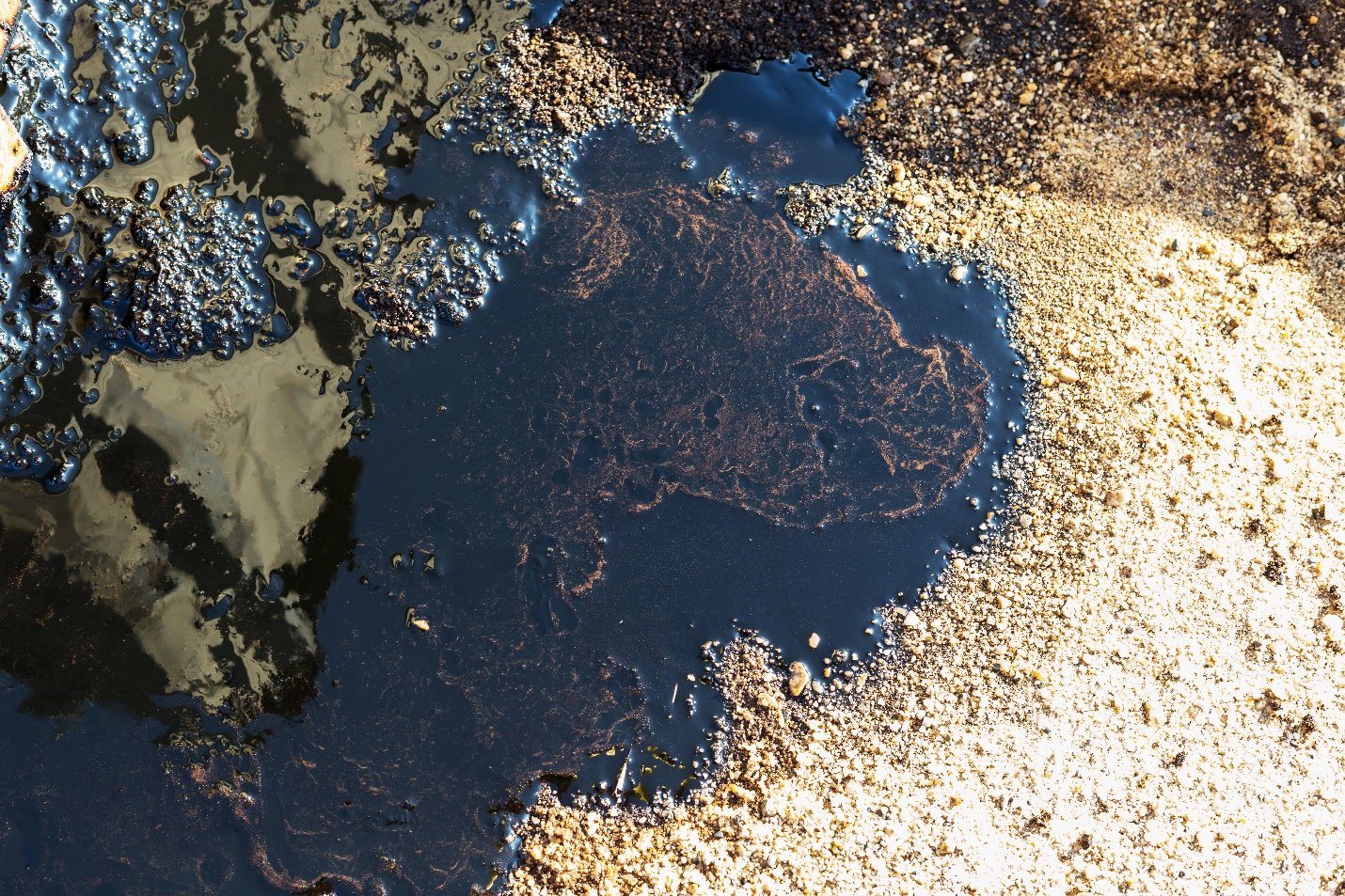 crude oil spill on sand