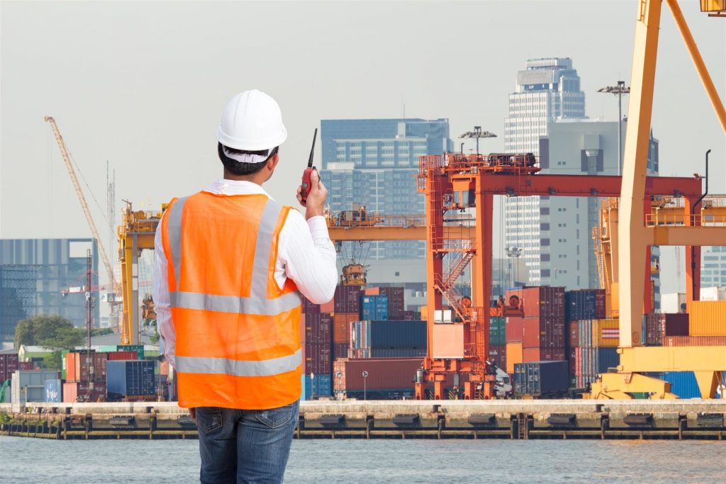 dock worker working in an industrial harbor