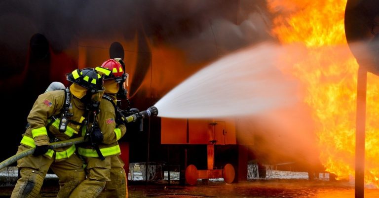 firemen blowing water on fire