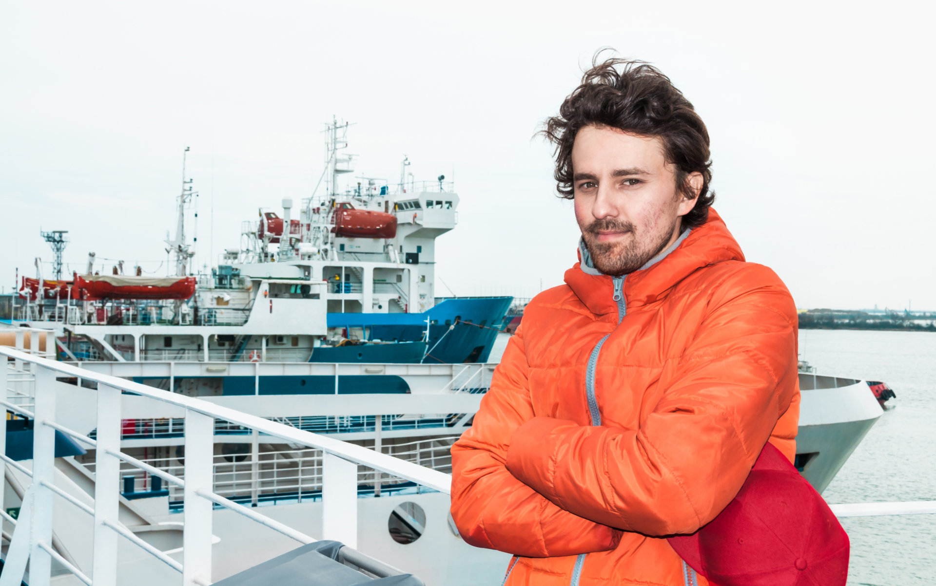 Portrait of a young successful man on the background sea landsca