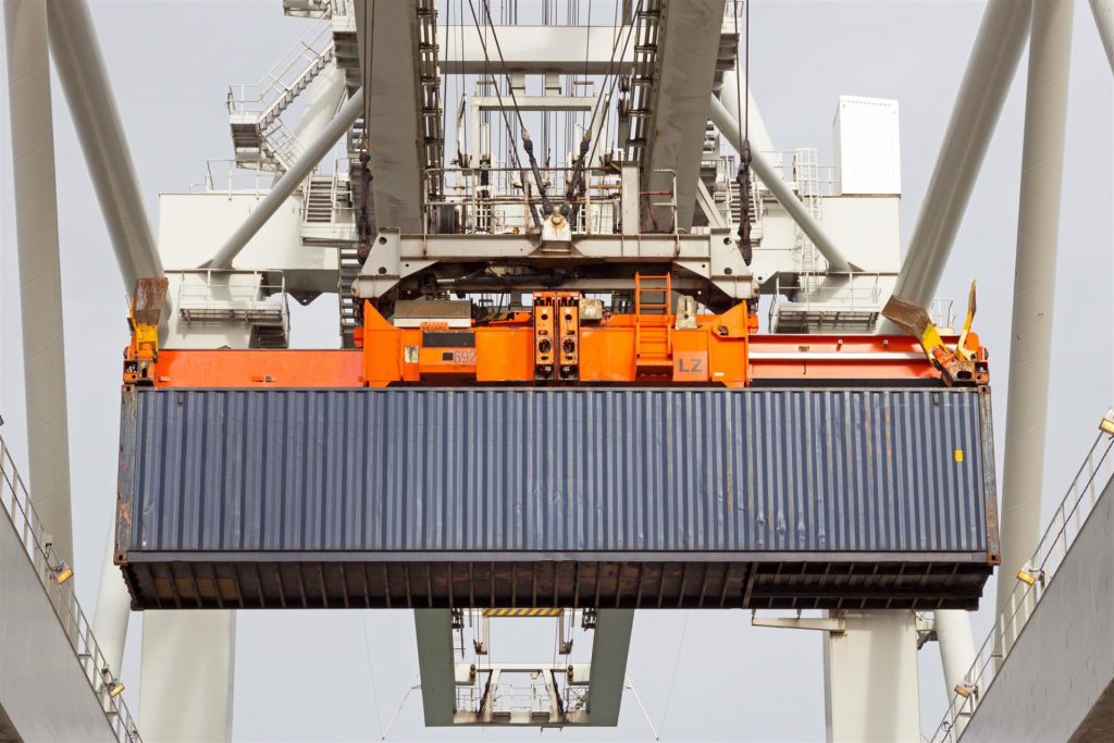 sea container lifted by a harbor crane