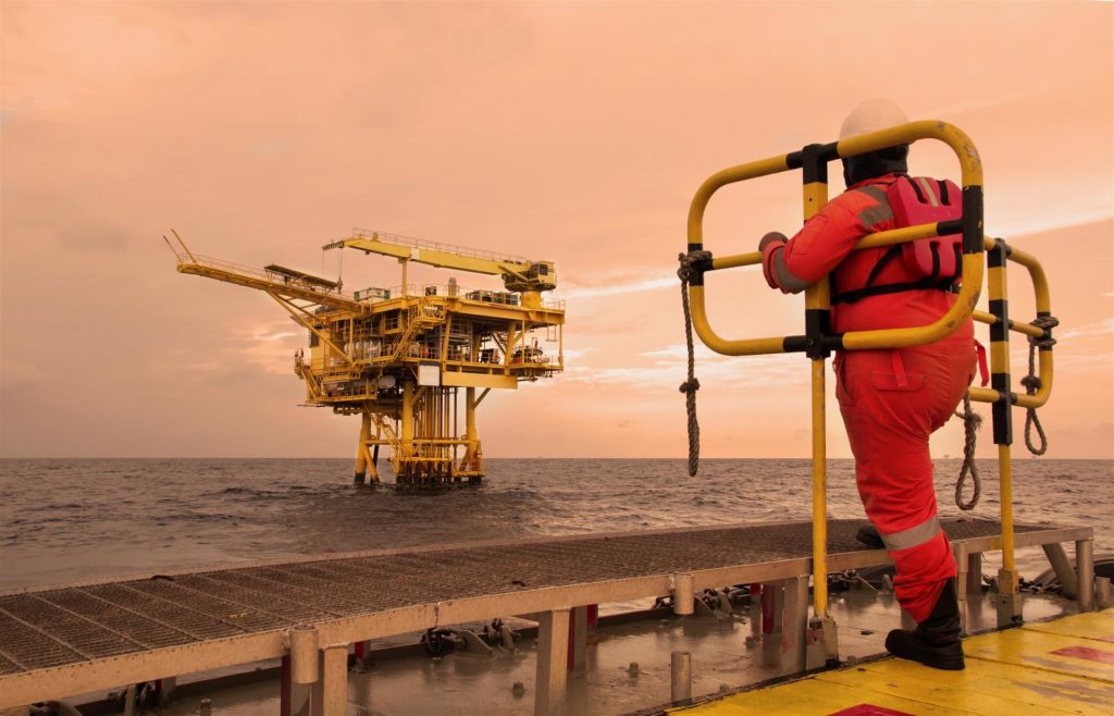 workers on transport boat to offshore rig