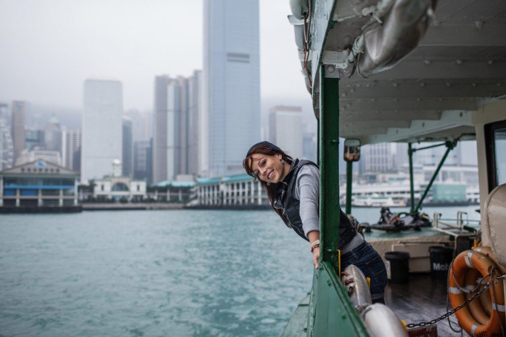 young girl tourist on a background of a big city with scrapers