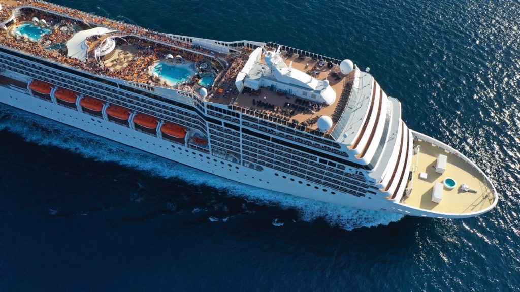 Aerial view of huge cruise liner with pools and outdoor facilities