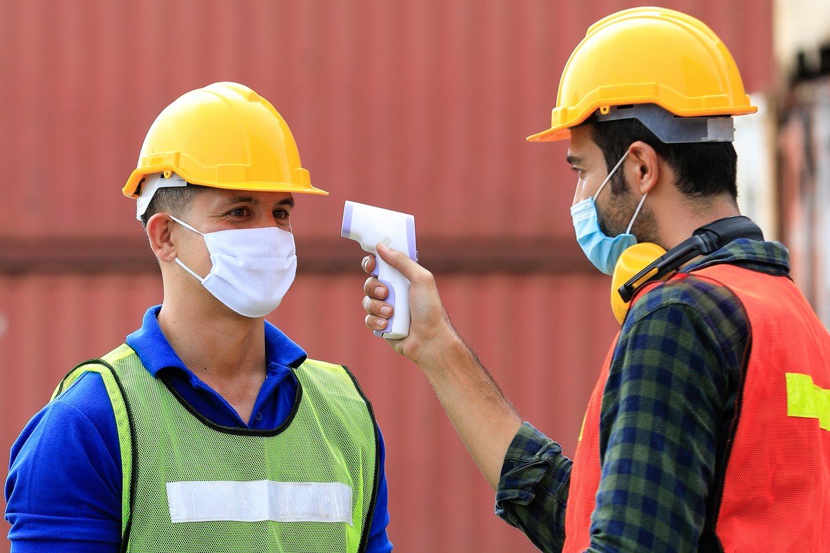 engineer teamwork wearing protection face mask against coronavirus