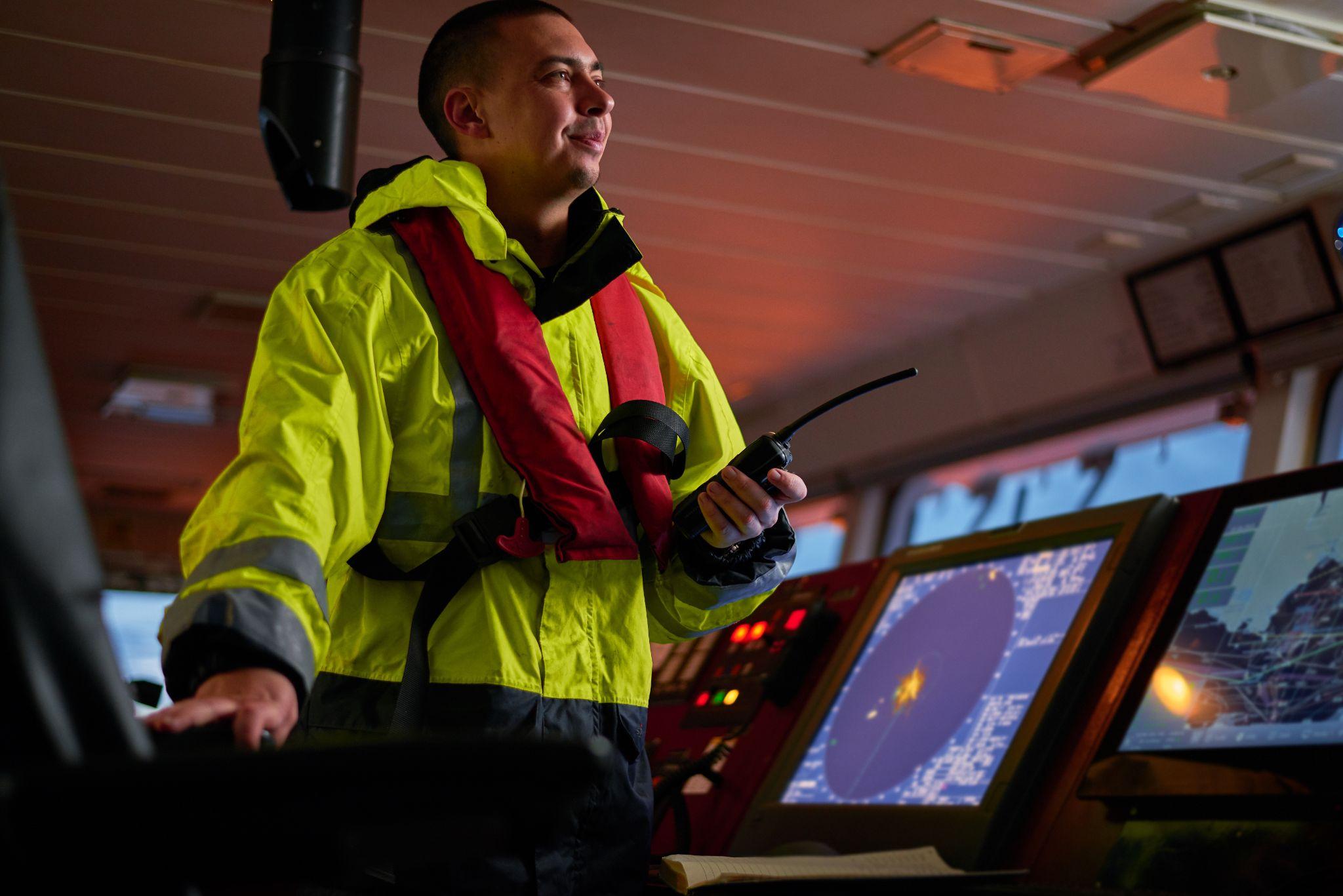 captain part of ship crew performing daily duties with VHF radio