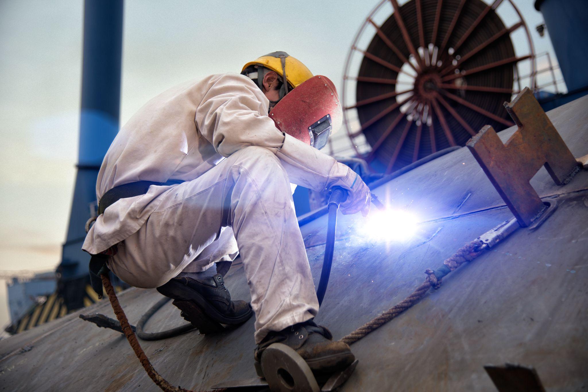 A welder in a shipyard
