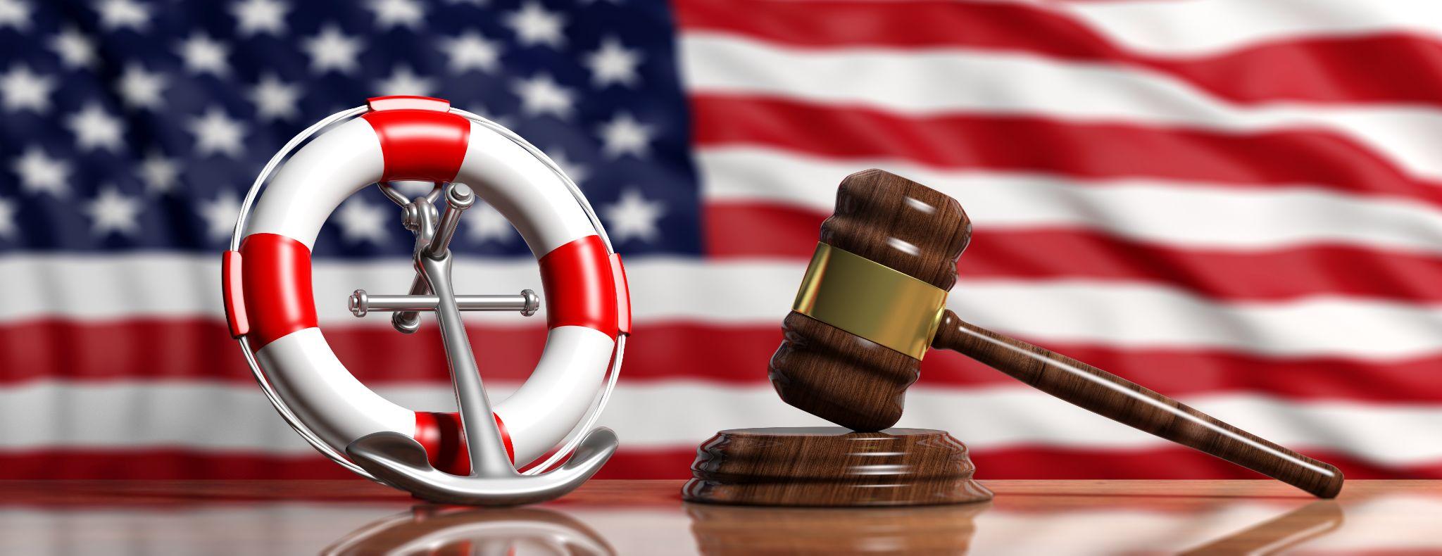 ship anchor and justice gavel on US of America flag background