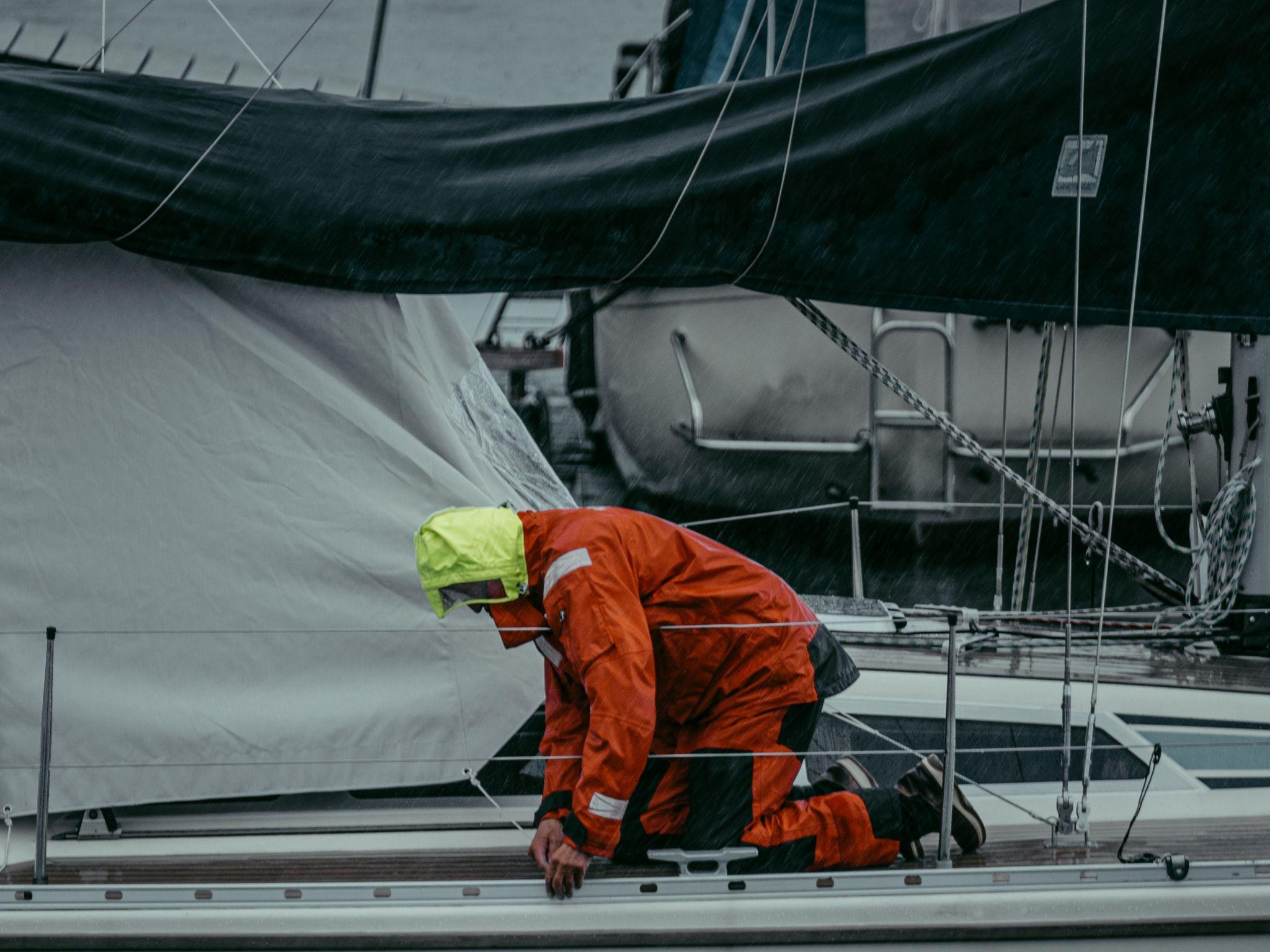 A man in safety gear working on a oil rig