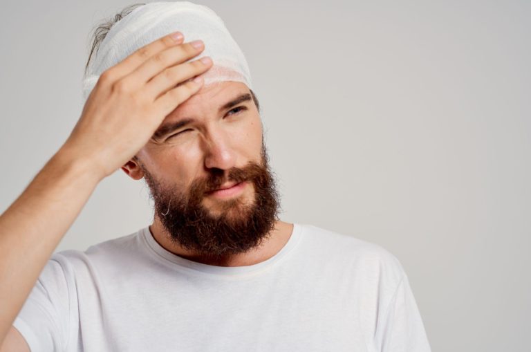 A man concussion with a bandage on his head