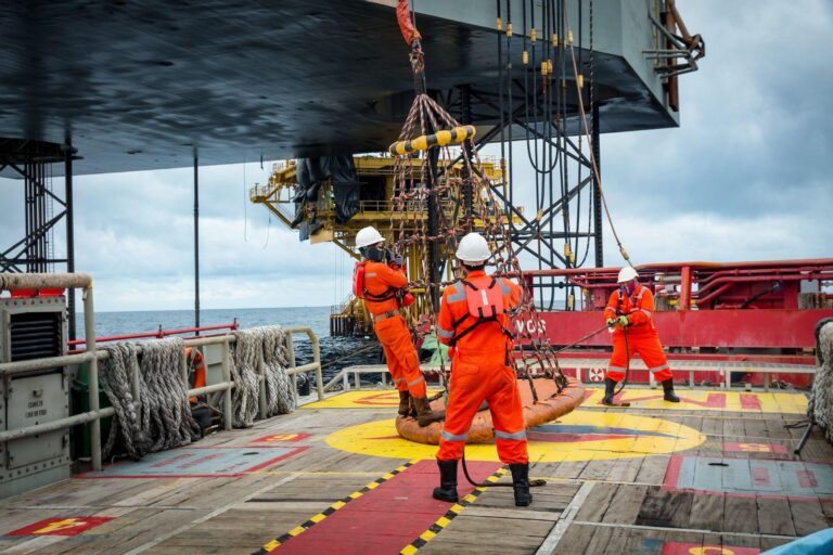 Personal basket tranfer form supply boat to oil&gas rig offshore during crew change by boat.