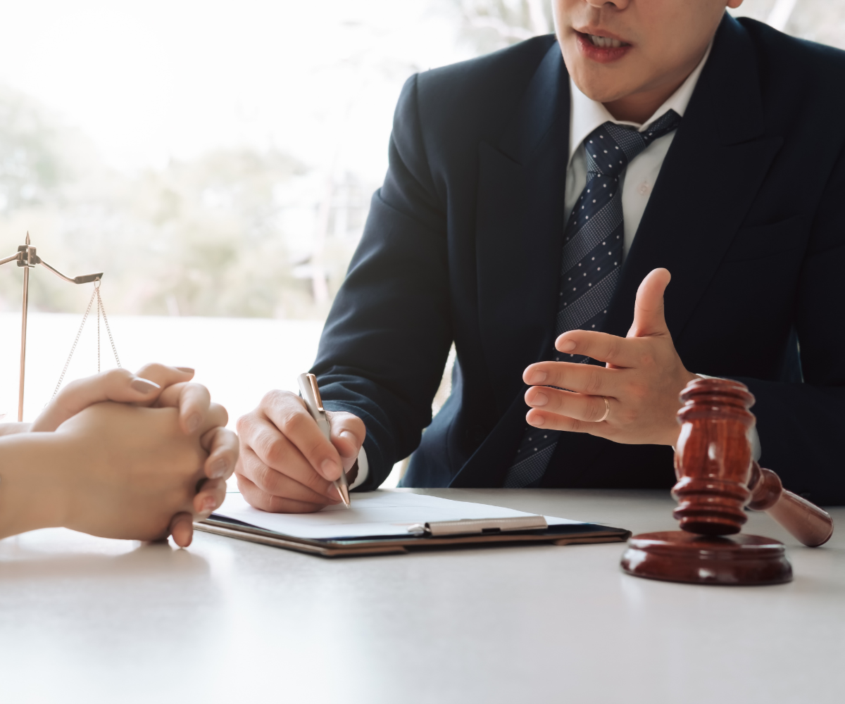 Real Estate Law concept. Gavel on sounding block in hand's Male judge at a courtroom