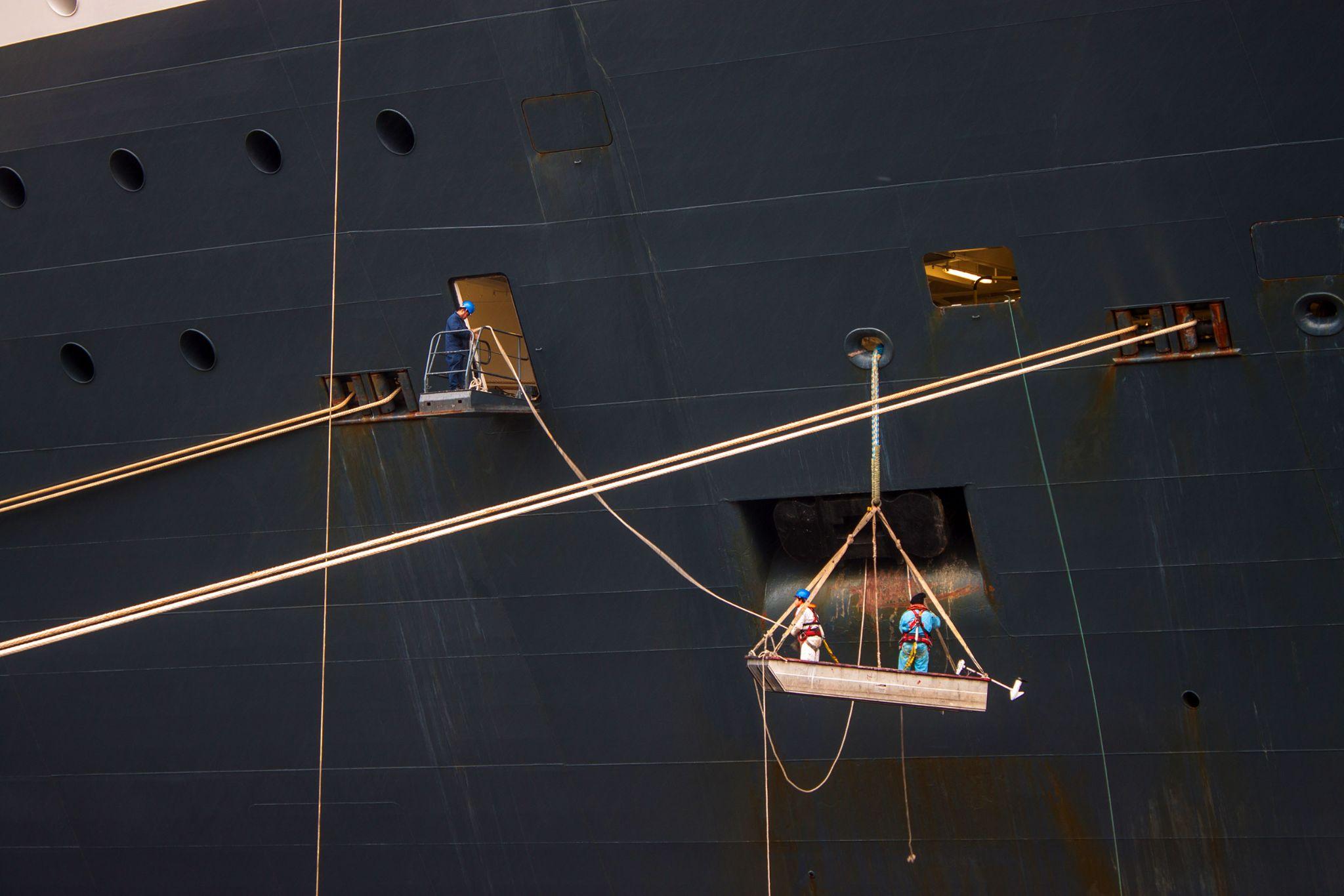 Workers at a hull of a ship
