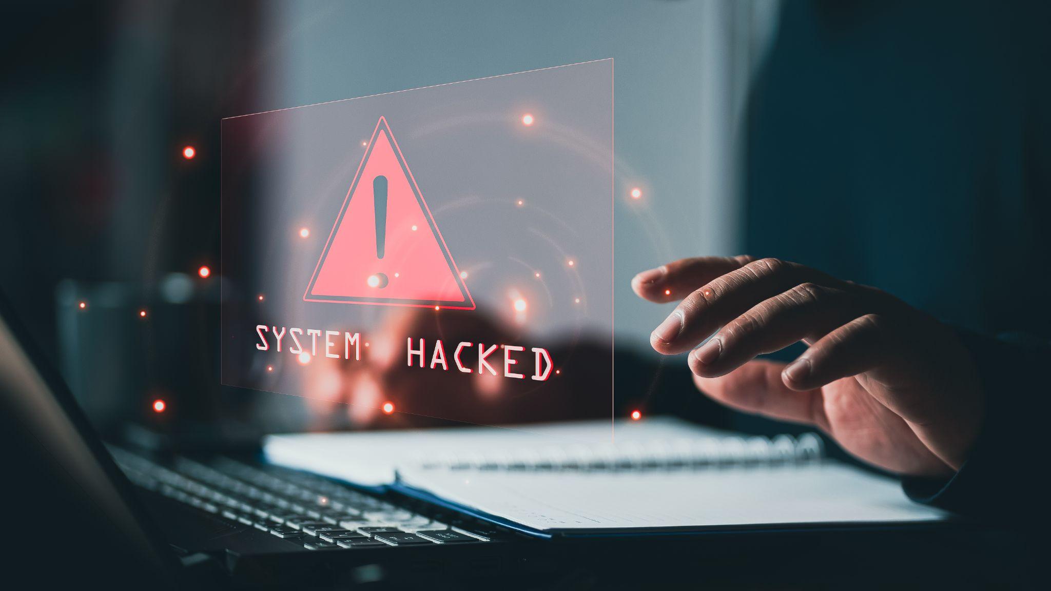 System hacked alert after cyber attack on computer network.