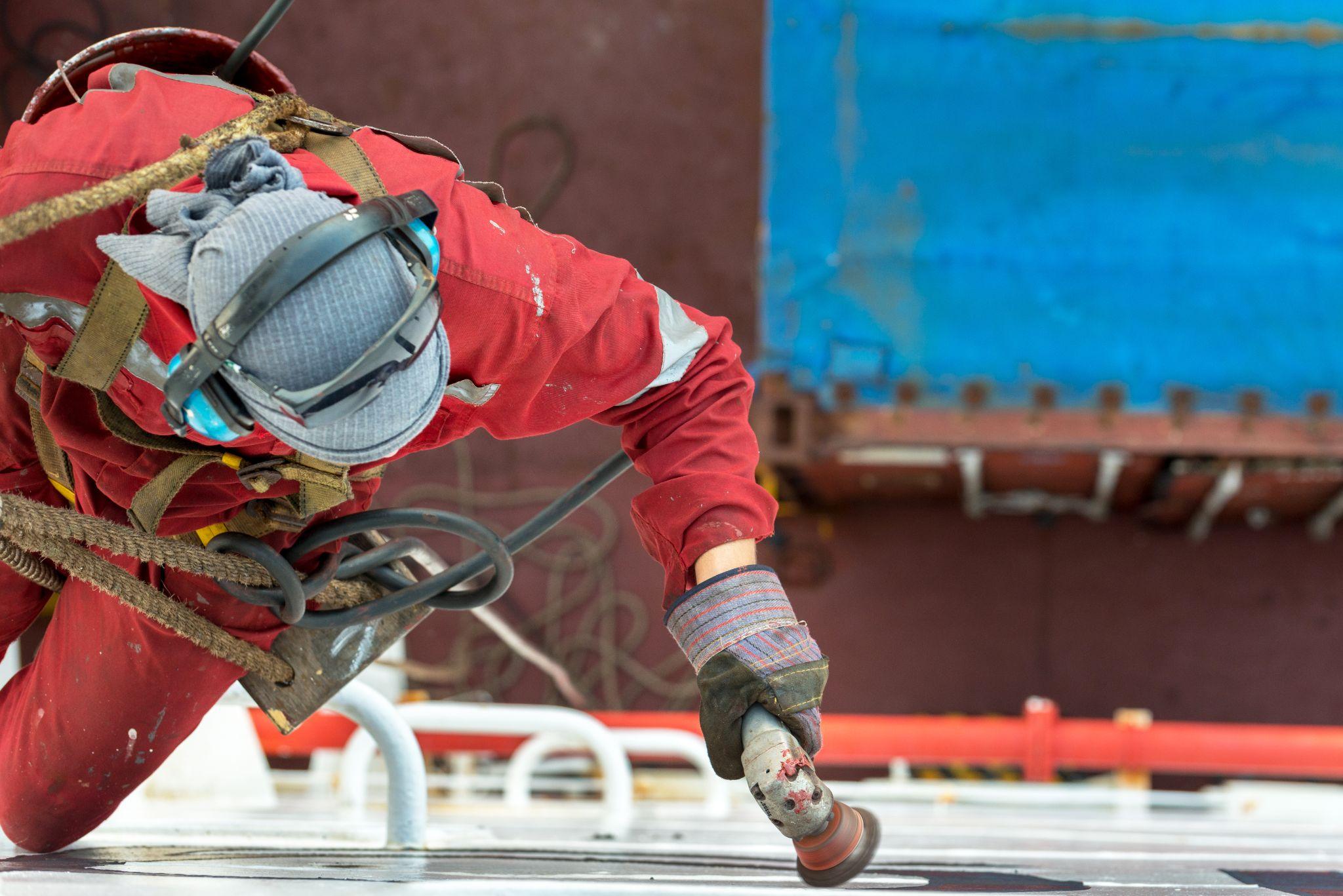 Maritime worker on a ship ladder